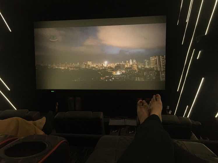Projection screen,Light,Projector accessory,Room,Lighting,Design,Technology,Movie theater,Display device,Darkness