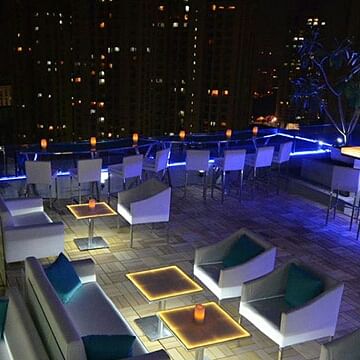 Lighting,Design,Building,Architecture,Interior design,Table,Furniture,Room,Stage,Nightclub