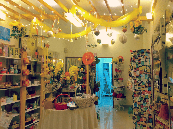 Building,Interior design,Yellow,Ceiling,Boutique,Retail,Room,Outlet store