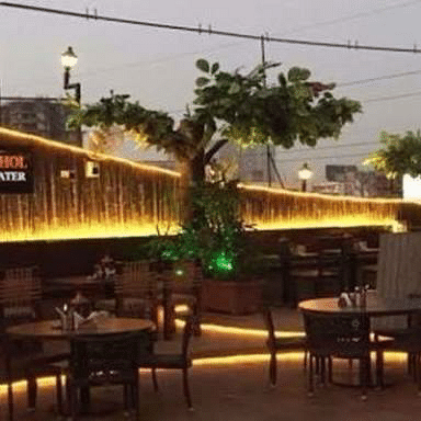 Restaurant,Tree,Table,Building,Night,Bar,Furniture,Plant