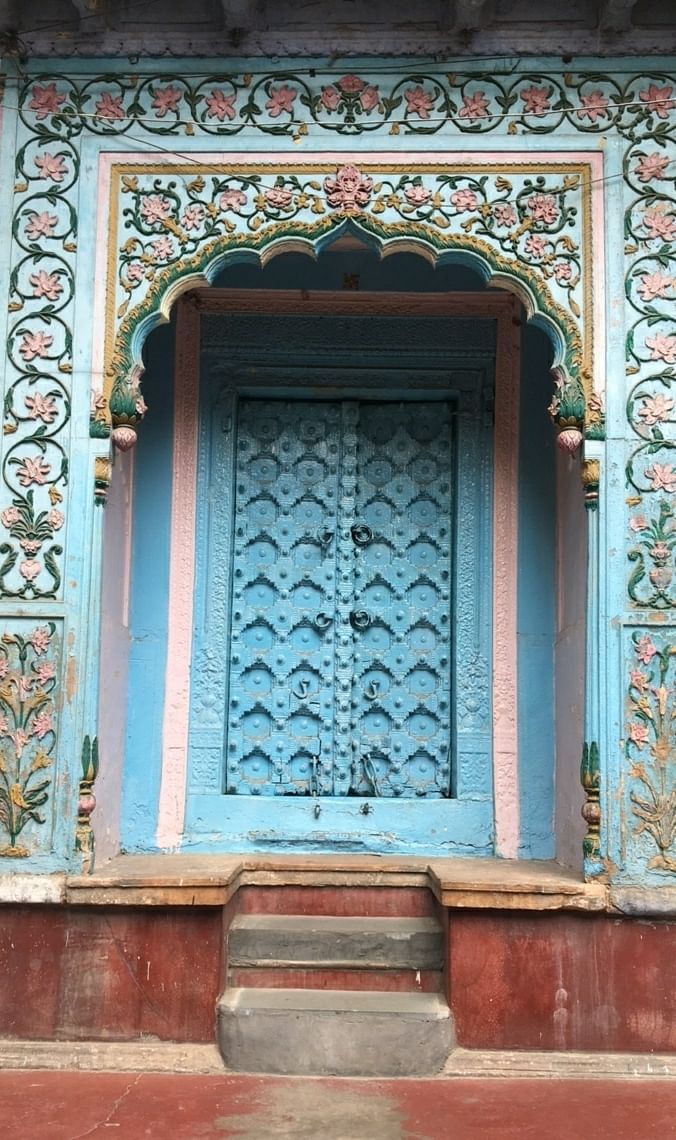 Blue,Door,Wall,Architecture,Window,Facade,Building,Symmetry,Carving,Stone carving