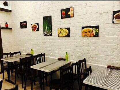 Restaurant,Wall,Room,Interior design,Table,Furniture,Building,Dining room,Brick,Fast food restaurant