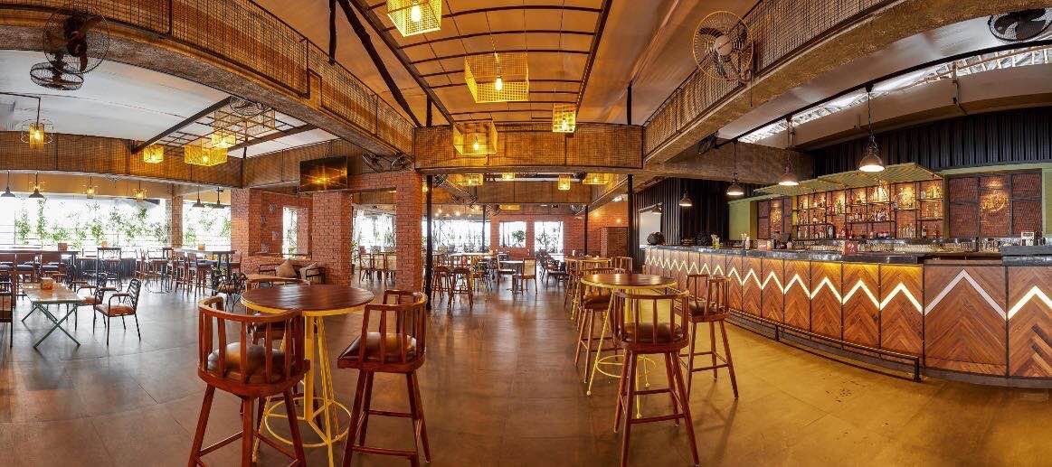 Building,Restaurant,Room,Bar,Interior design,Architecture,Cafeteria,Table,Furniture,Lobby