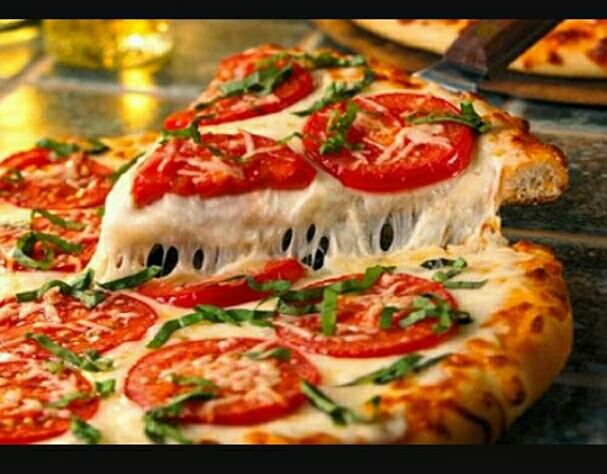 Dish,Food,Cuisine,Pizza cheese,Ingredient,Pizza,Flatbread,Italian food,Garnish,Produce