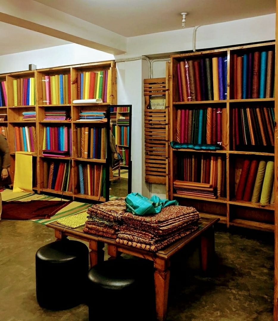 Bookcase,Shelving,Furniture,Shelf,Room,Library,Building,Interior design,Public library,Table