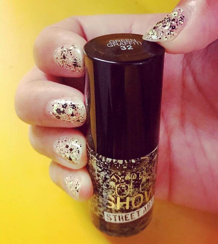 Nail polish,Nail,Nail care,Manicure,Cosmetics,Brown,Finger,Glitter,Liquid,Material property