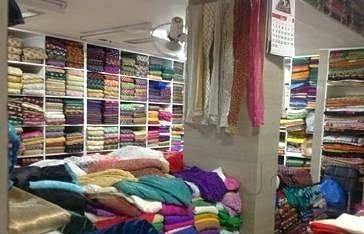 Room,Textile,Interior design,Building,Furniture,Closet,Outlet store,Retail,Linens,Floor
