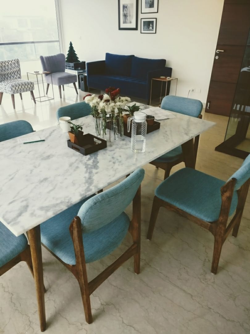 Furniture,Room,Table,Turquoise,Property,Dining room,Chair,Interior design,Kitchen & dining room table,Coffee table