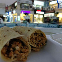 Dish,Food,Cuisine,Kati roll,Ingredient,Mission burrito,Sandwich wrap,Shawarma,Burrito,Taquito