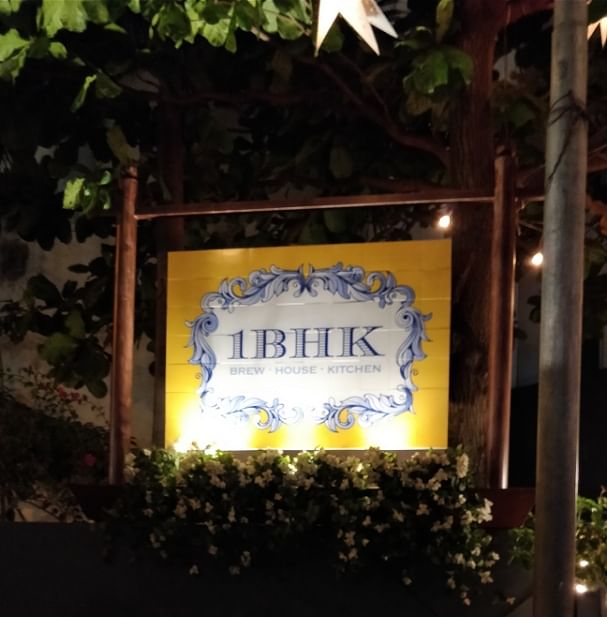 Majorelle blue,Signage,Tree,Font,Night,Sign,Plant,House