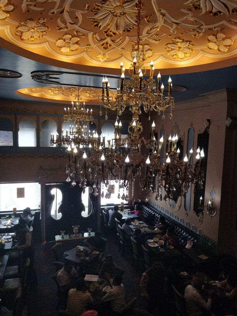 Chandelier,Ceiling,Lighting,Light fixture,Interior design,Architecture,Building,Ballroom,Room,Restaurant