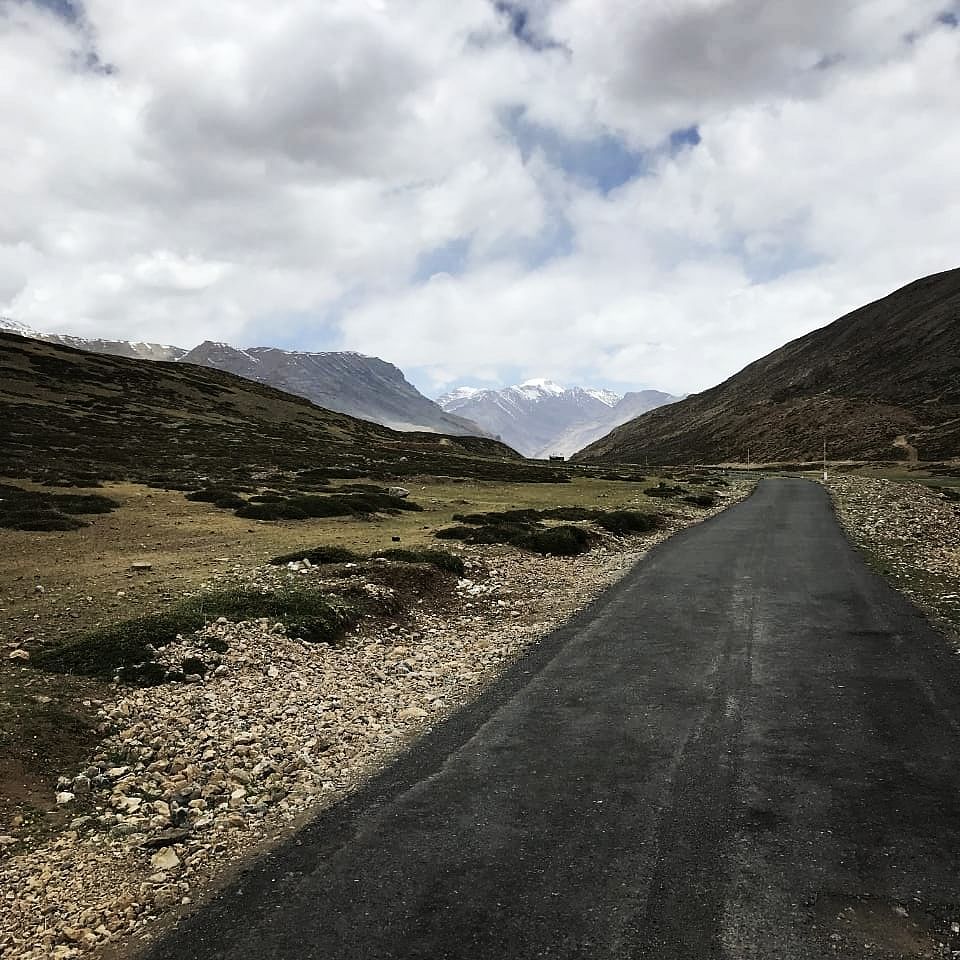 Highland,Mountainous landforms,Mountain,Road,Sky,Hill,Fell,Asphalt,Road surface,Mountain pass