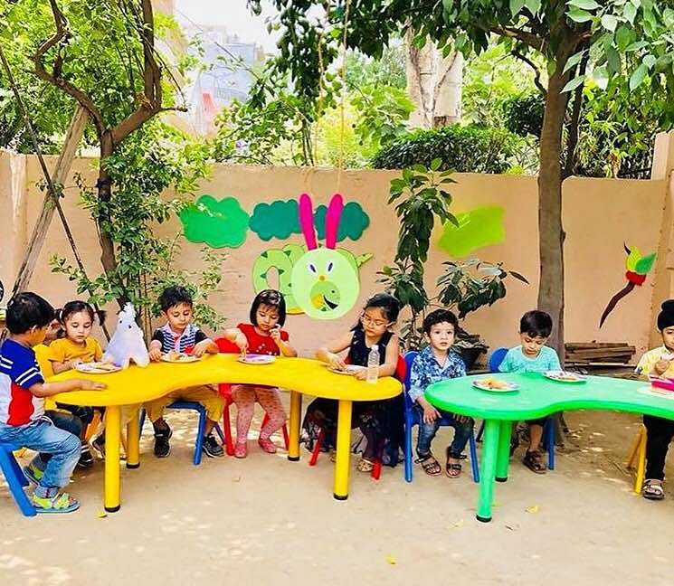 Table,Child,Leisure,Yellow,Play,Community,Public space,Fun,Adaptation,Tree