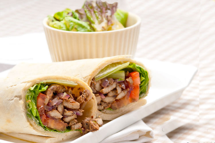 Dish,Food,Cuisine,Sandwich wrap,Ingredient,Gyro,Shawarma,Mission burrito,Produce,Sandwich