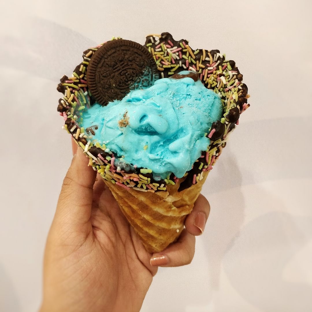 Ice cream cone,Frozen dessert,Food,Dessert,Gelato,Ice cream,Turquoise,Cream,Dairy,Sweetness