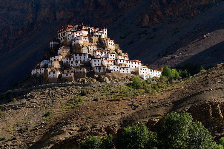 Landmark,Sky,Natural landscape,Historic site,Mountain,Rock,Geology,Ancient history,Formation,Fortification