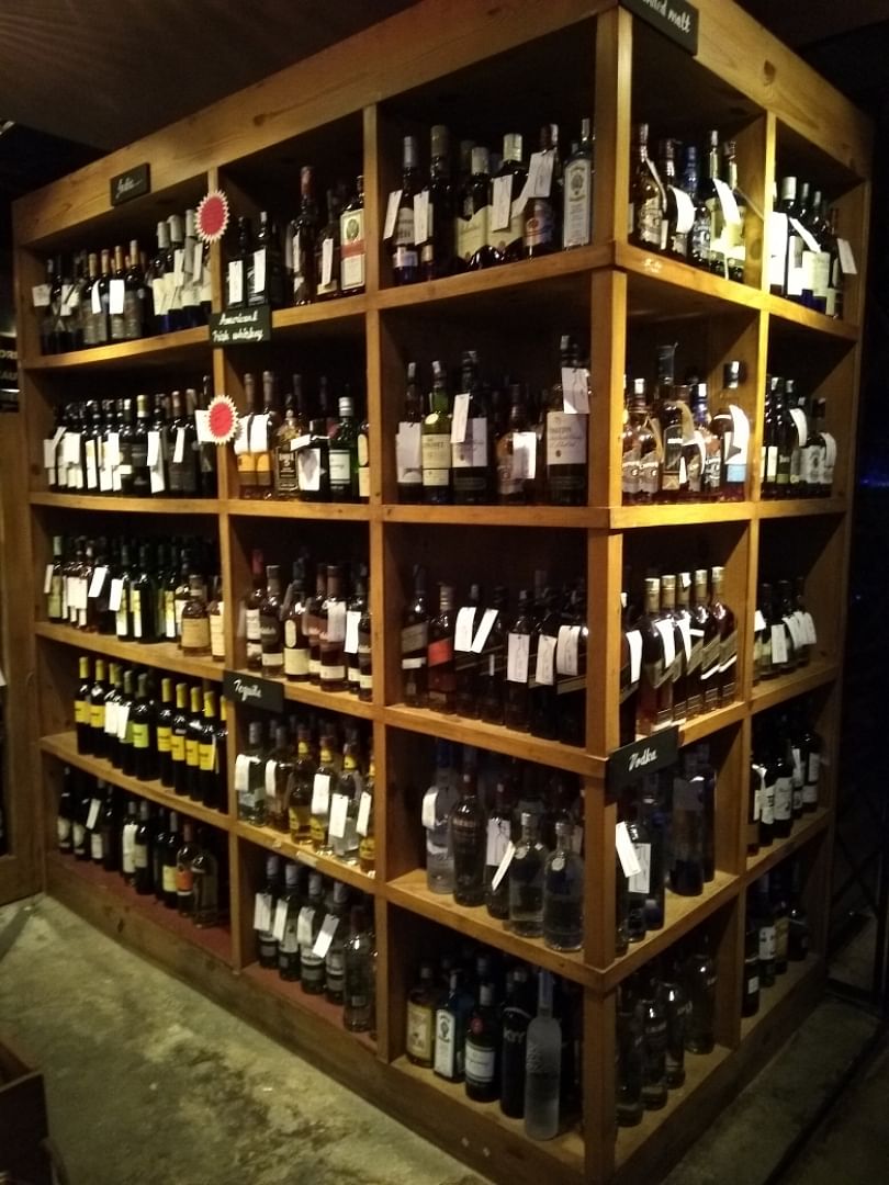 Liquor store,Wine cellar,Drinking establishment,Alcohol,Distilled beverage,Furniture,Wine rack,Winery,Bottle,Glass bottle