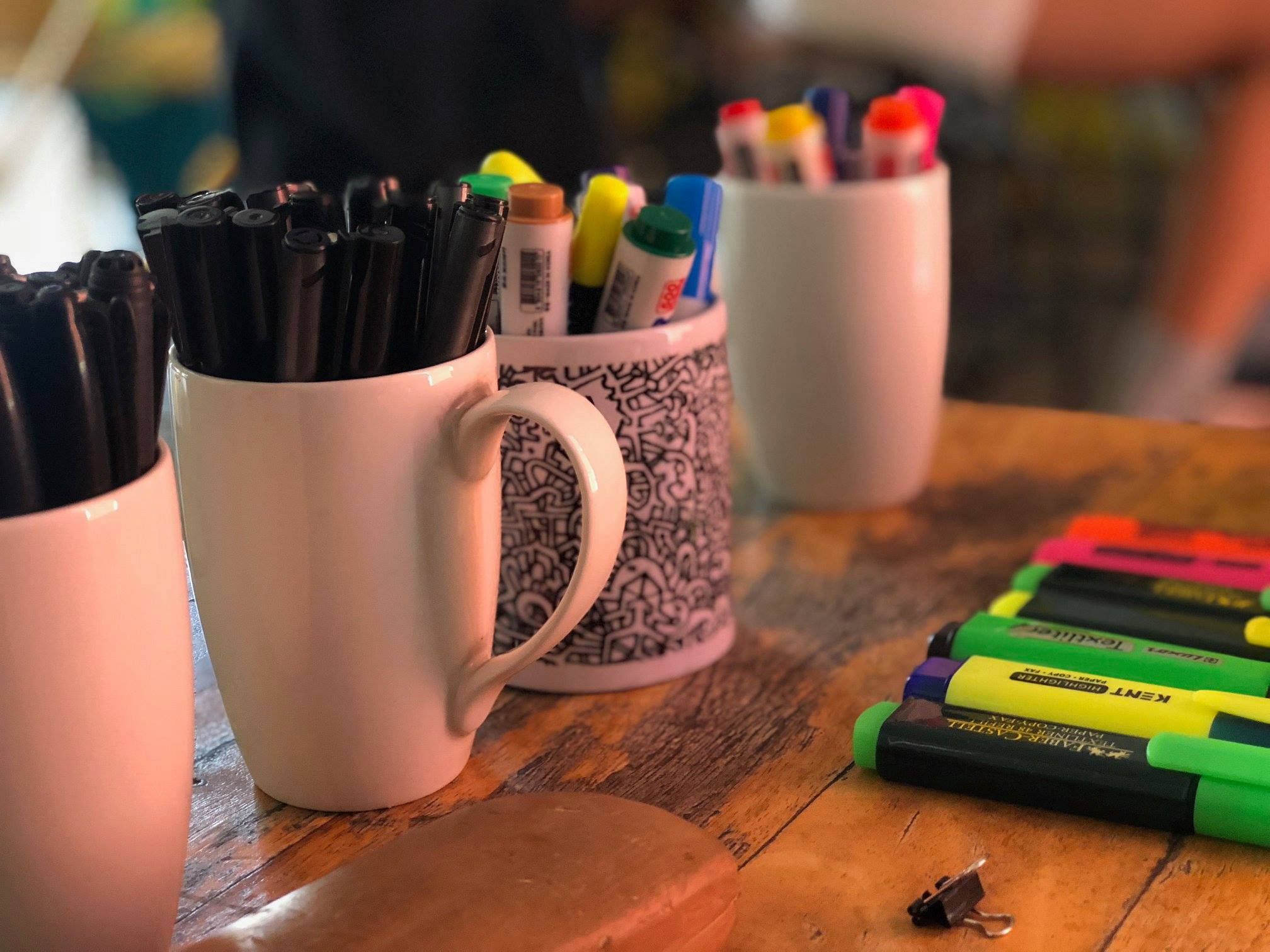 Writing implement,Cup,Pencil,Marker pen,Office supplies,Hand,Mug,Finger,Pen,Crayon