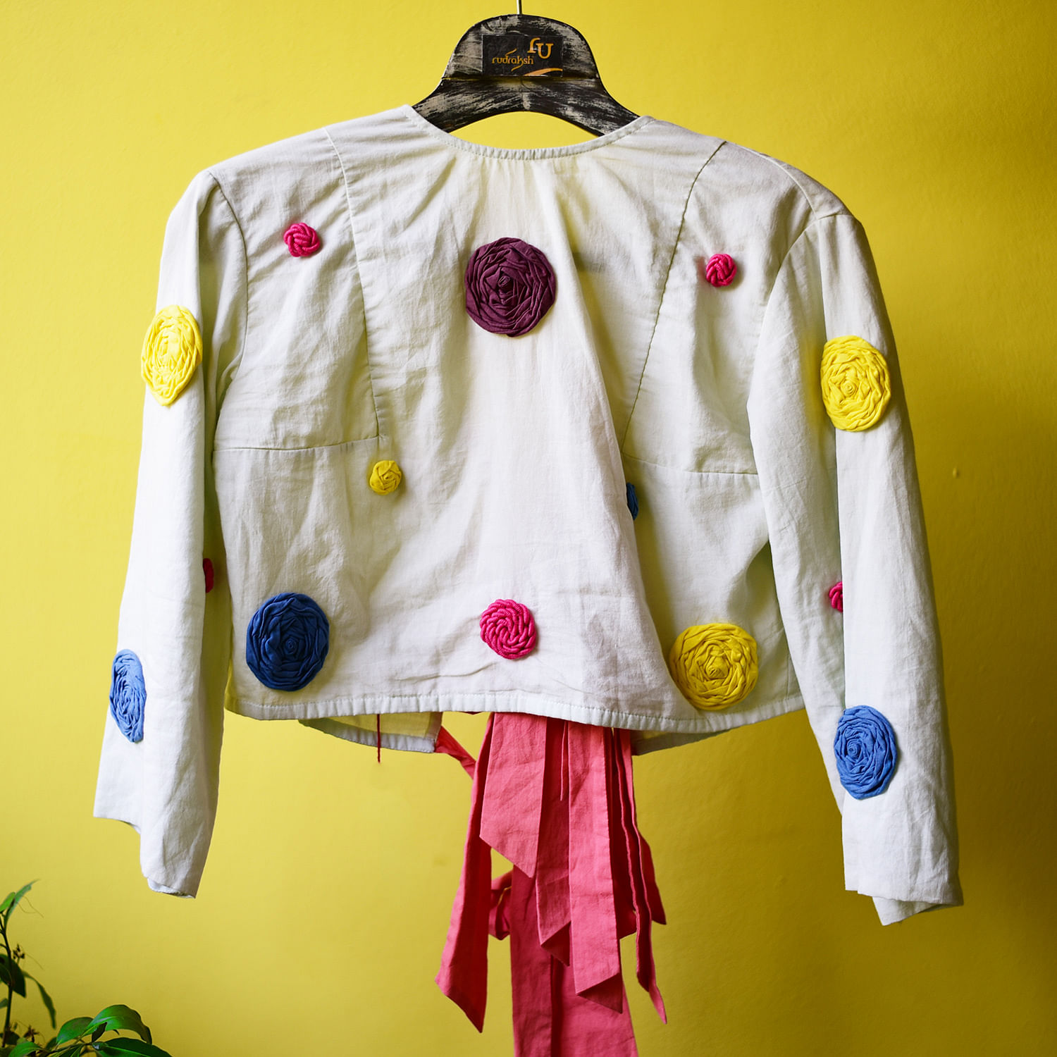 Clothing,White,Yellow,Outerwear,Sleeve,Textile,Magenta,Uniform,Costume,Costume design