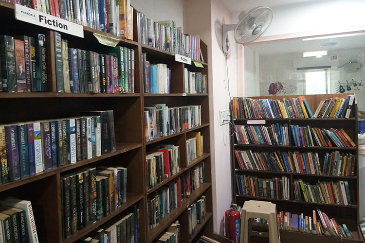 Bookcase,Shelving,Library,Shelf,Public library,Book,Bookselling,Publication,Furniture,Building