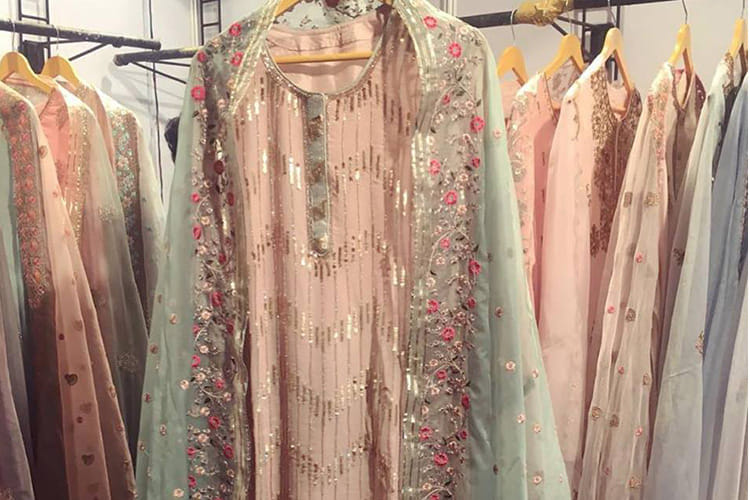 Clothing,Boutique,Dress,Pink,Room,Clothes hanger,Peach,Formal wear,Textile,Vintage clothing