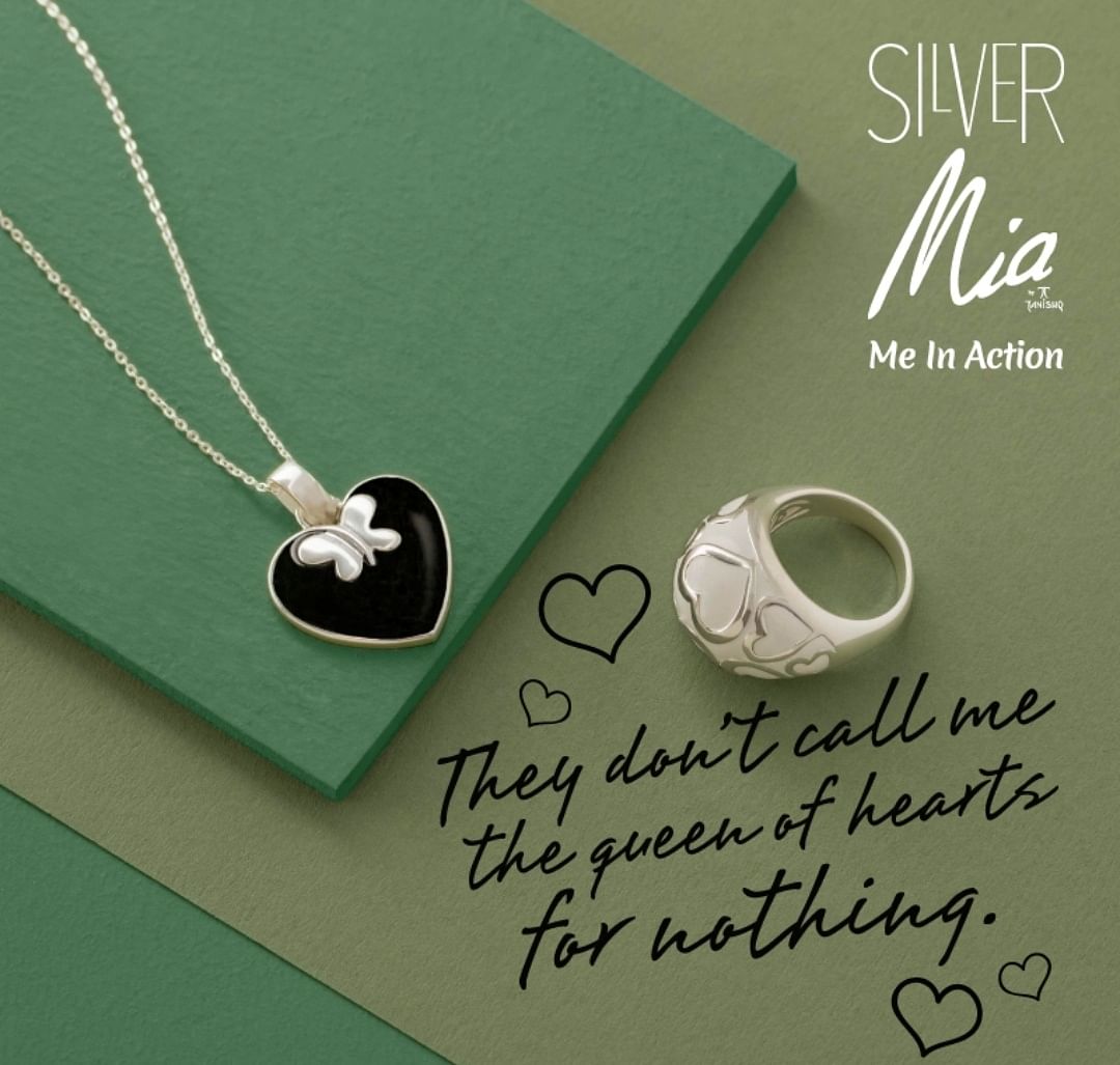Green,Pendant,Fashion accessory,Jewellery,Calligraphy,Silver,Font,Necklace,Locket,Metal