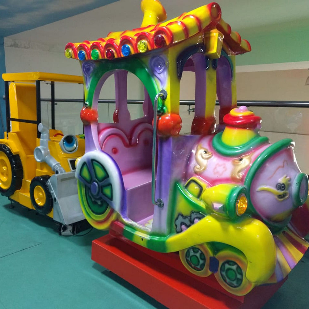 Toy,Playset,Product,Fun,Mode of transport,Amusement ride,Public space,Recreation,Vehicle,Amusement park