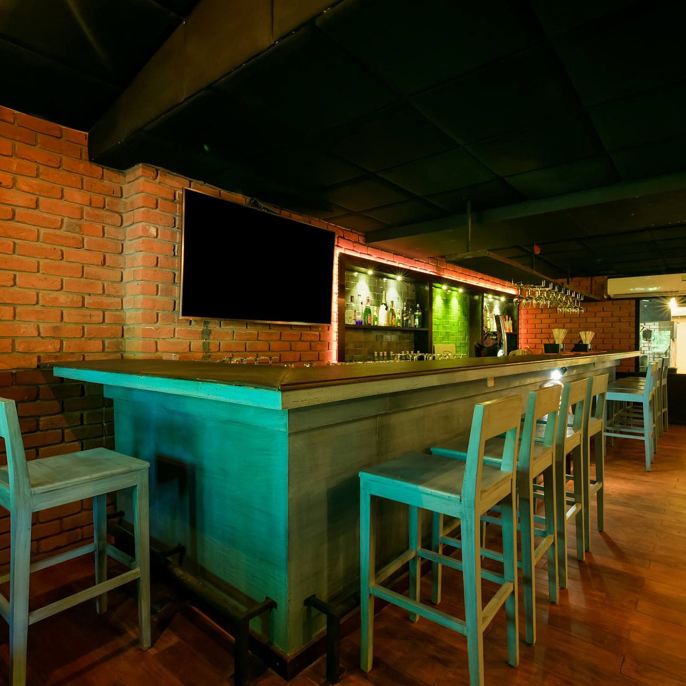 Table,Room,Furniture,Lighting,Bar stool,Building,Bar,Architecture,Interior design,Recreation room