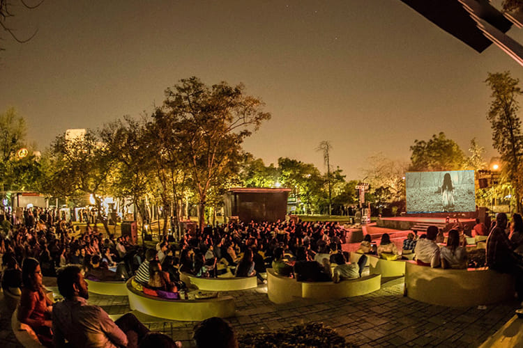 Crowd,Stage,Event,Night,Performance,Sky,Musical ensemble,Performance art,Tree,Photography