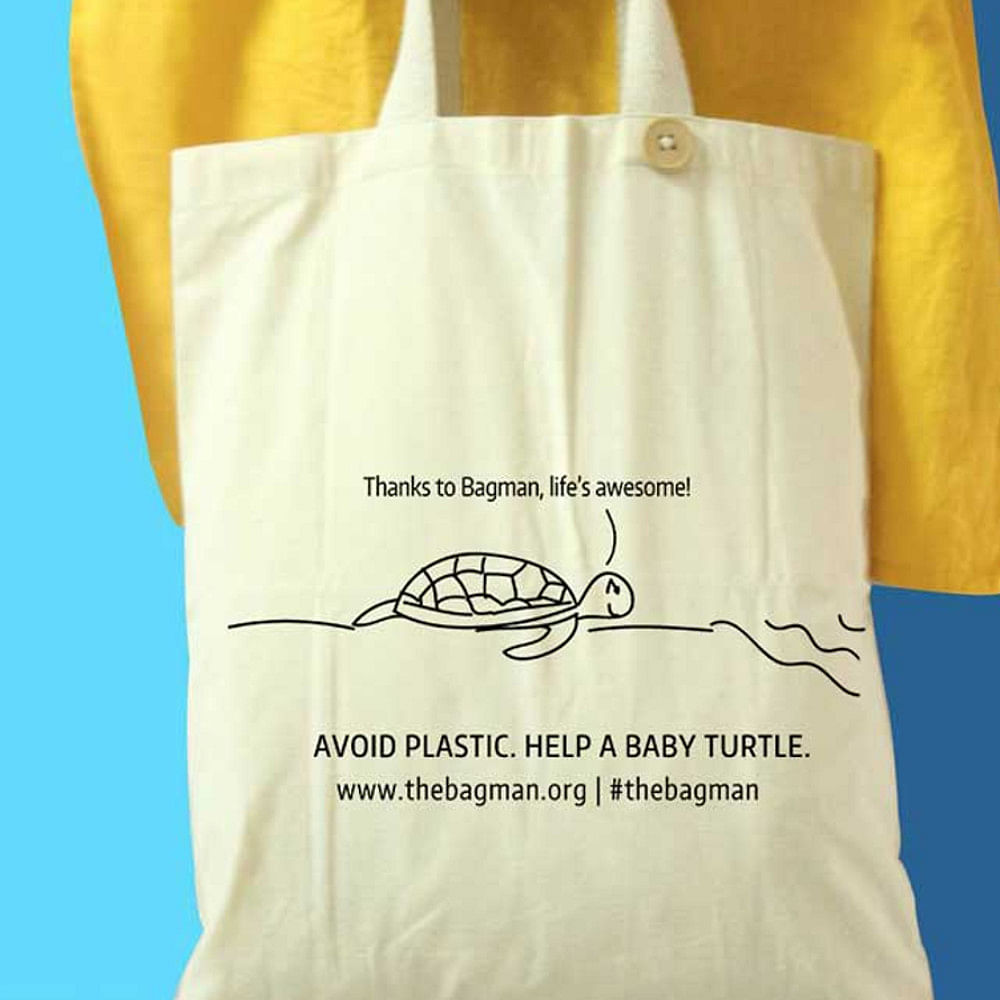 Bag,Yellow,Shopping bag,Handbag,Tote bag,Font,Luggage and bags,Packaging and labeling,Fashion accessory,Paper bag