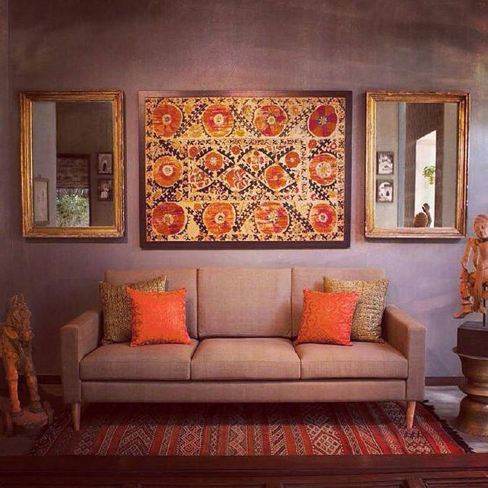 Orange,Wall,Room,Furniture,Living room,Modern art,Couch,Interior design,Painting,Art