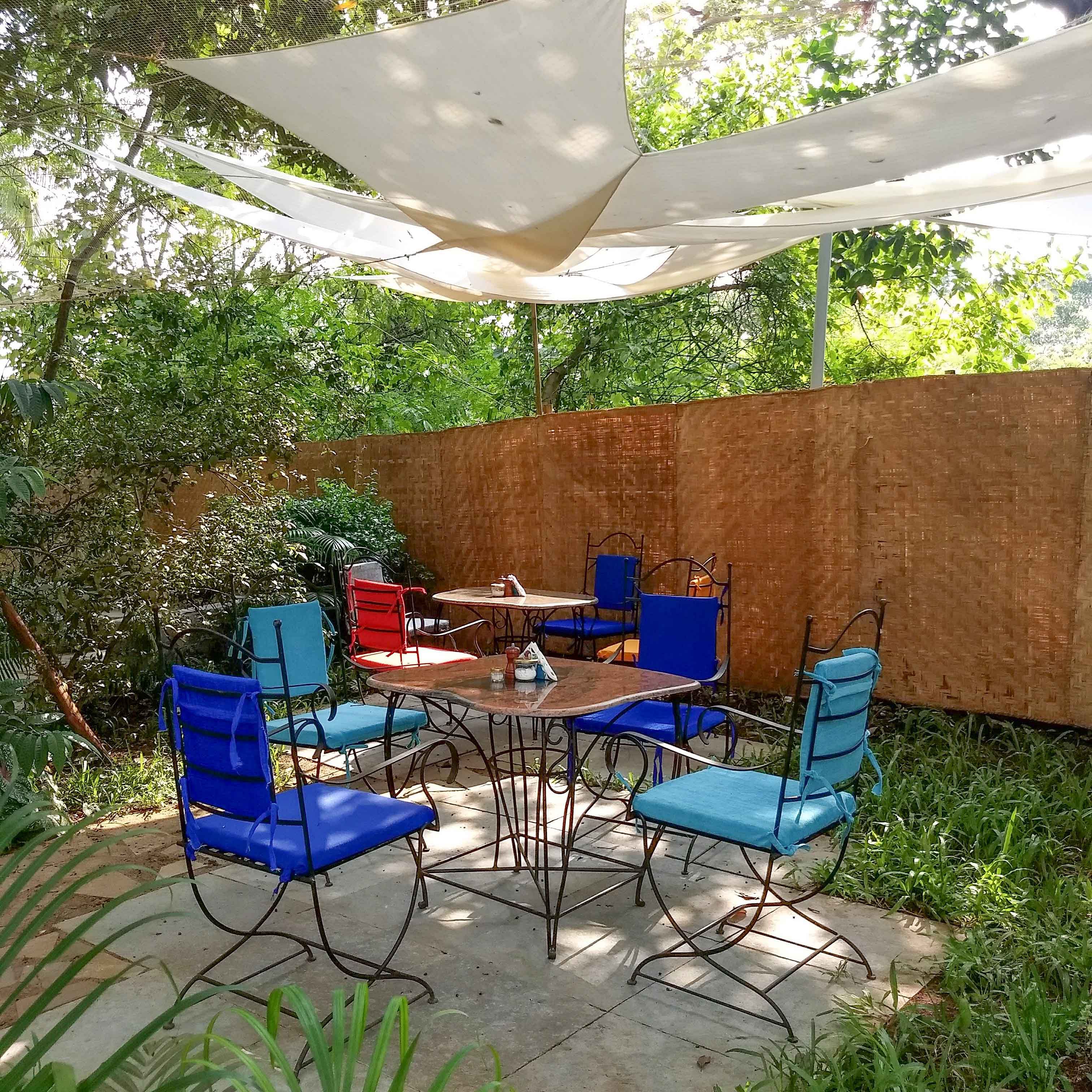 Patio,Backyard,Yard,Property,Shade,Garden,Table,Furniture,Real estate,House