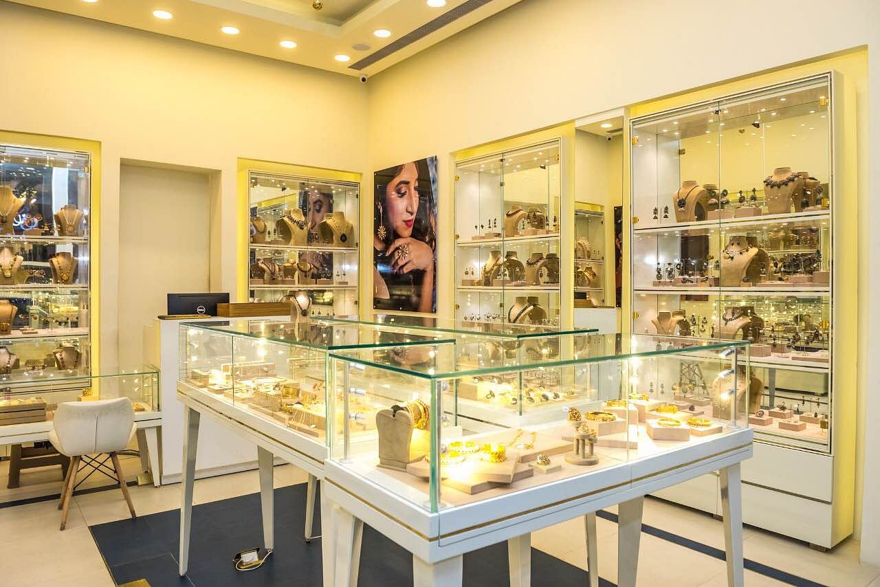 Display case,Building,Yellow,Museum,Interior design,Bakery,Tourist attraction,Collection,Room,Art gallery