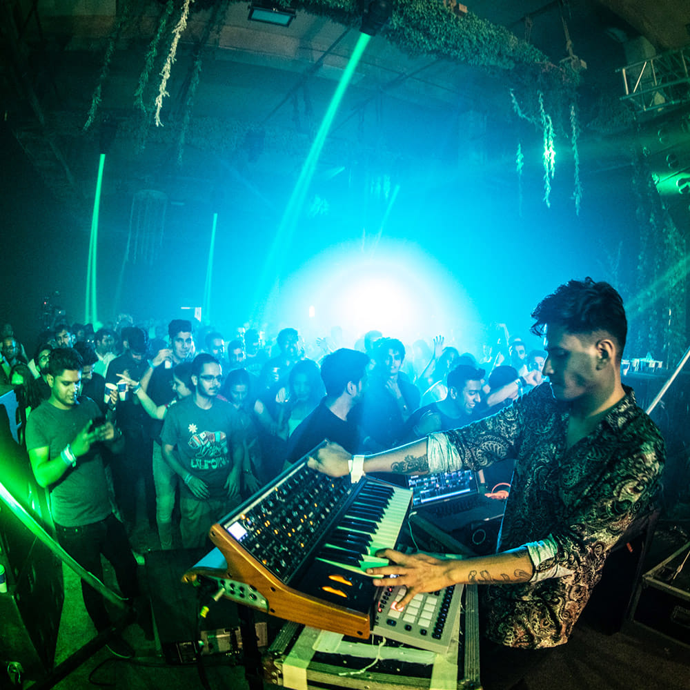 Green,Electronics,Performance,Event,Music venue,Nightclub,Technology,Crowd,Stage,Deejay