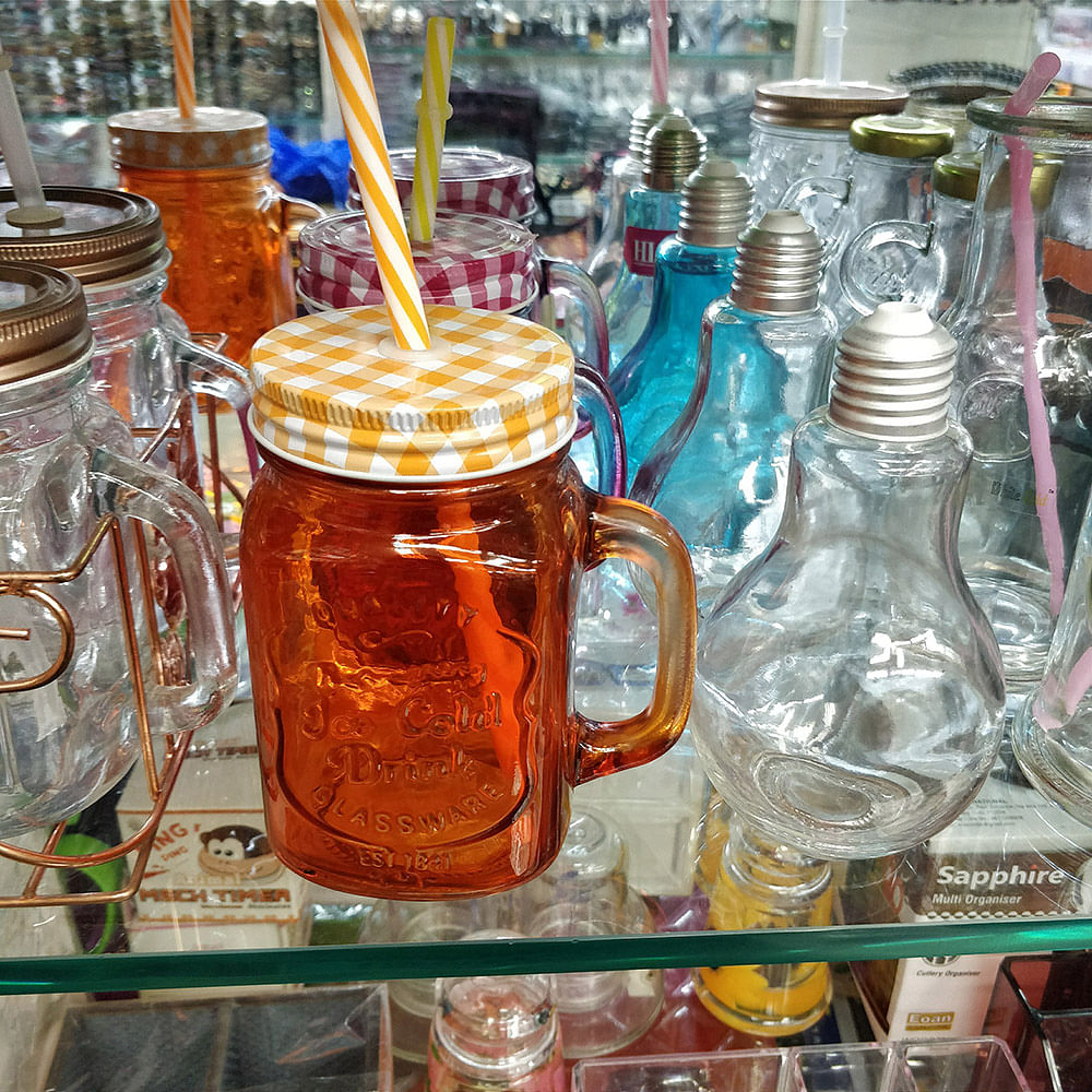 Mason jar,Glass,Drinkware,Tableware,Bottle,Home accessories,Drink,City,Food storage containers