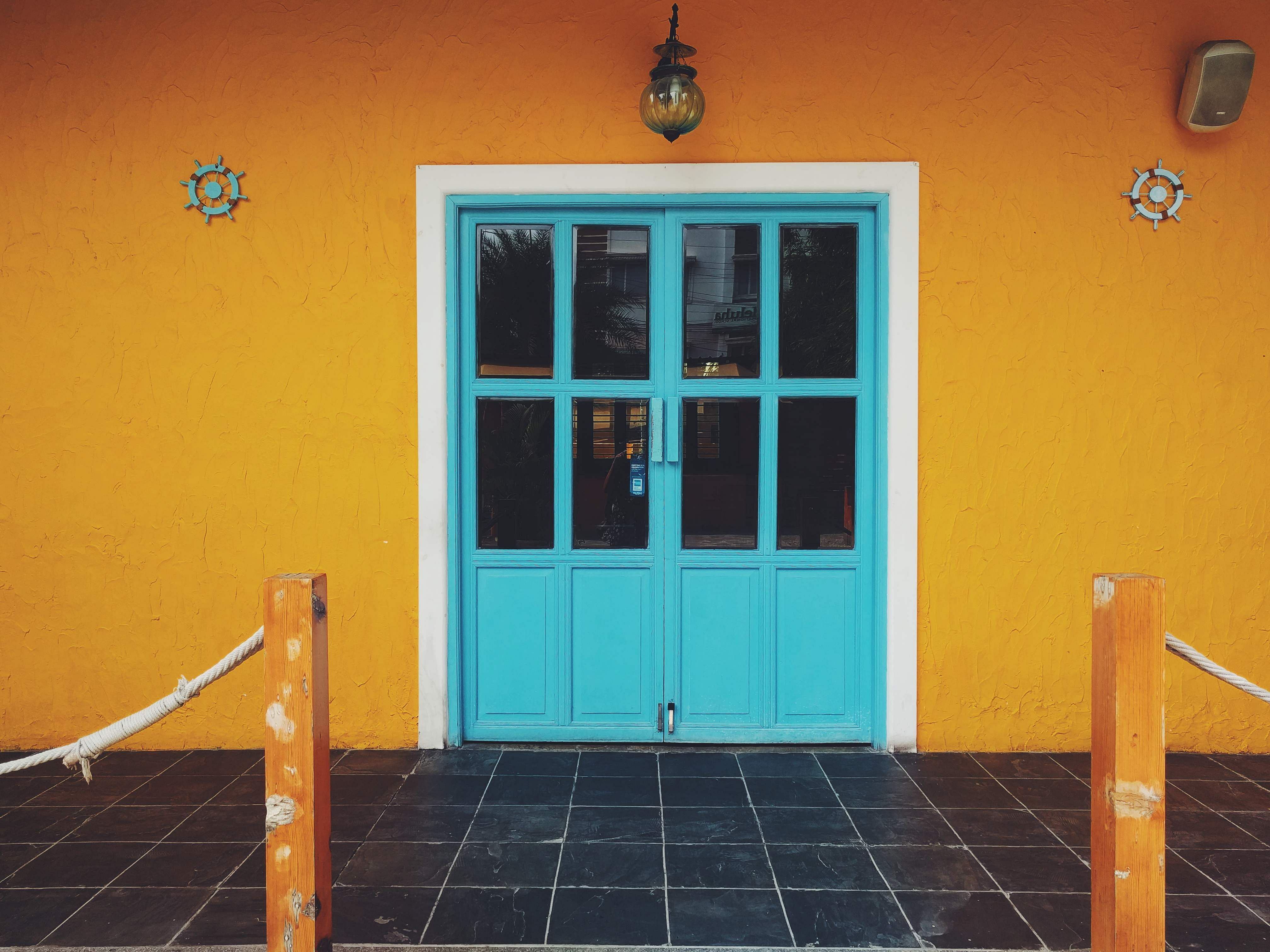 Blue,Orange,Yellow,Property,Door,Turquoise,Wall,House,Room,Floor