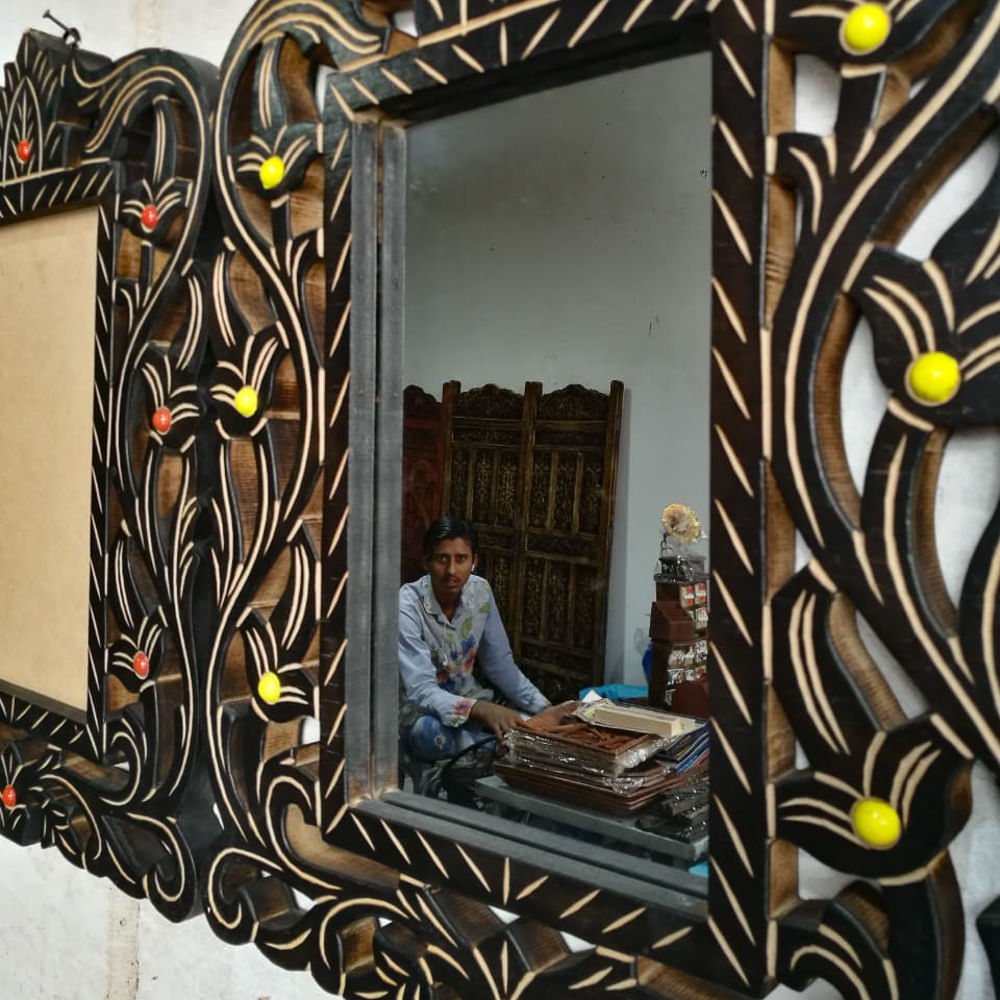 Mirror,Room,Wall,Furniture,Interior design,Art,Visual arts,Picture frame,Bed,Chair