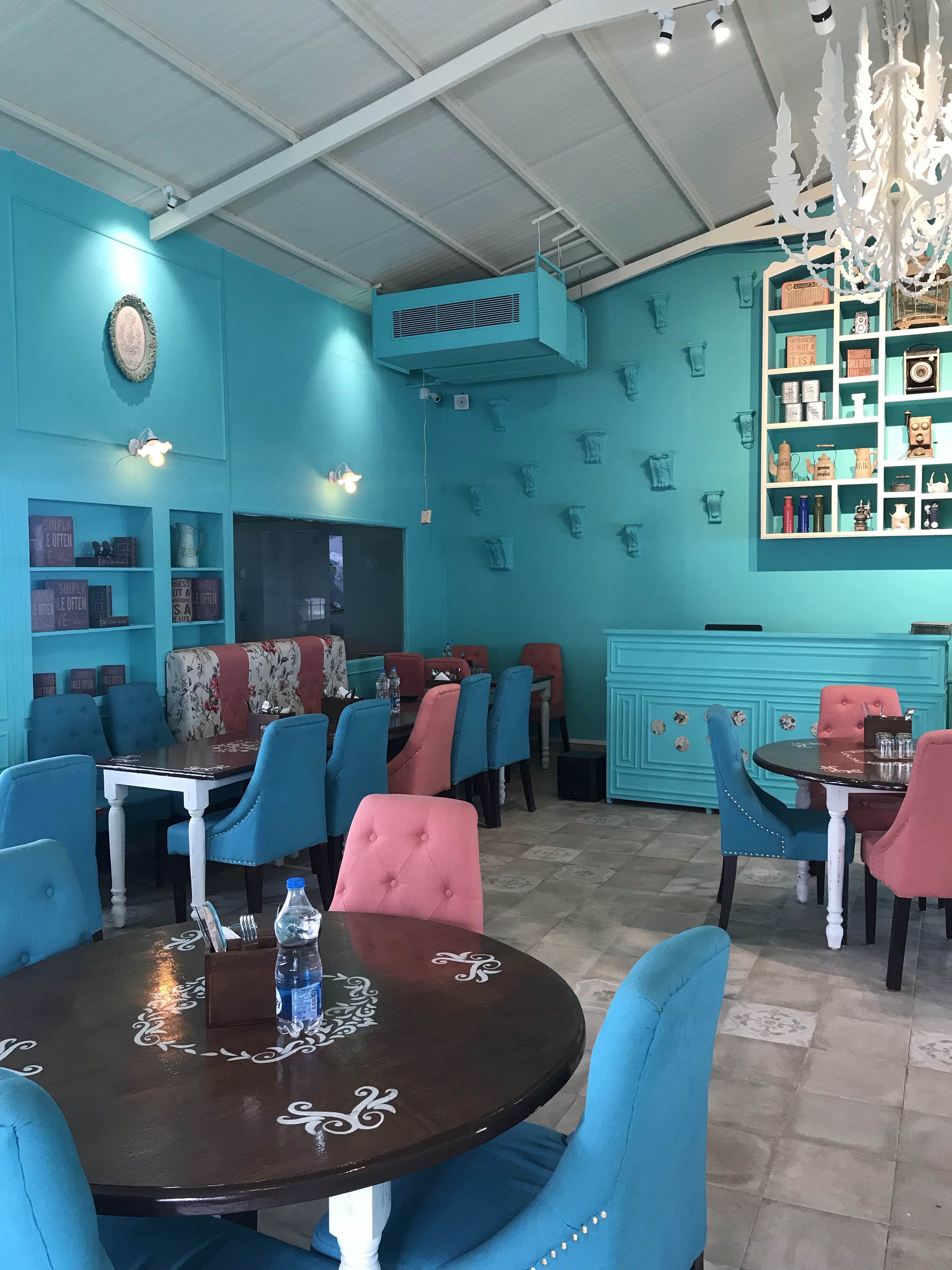 Blue,Turquoise,Room,Restaurant,Interior design,Building,Teal,Table,Turquoise,Furniture