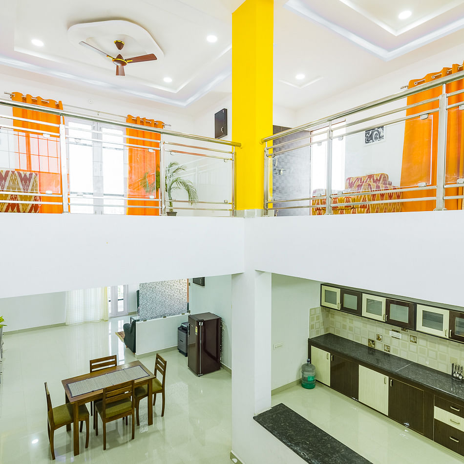 Interior design,Yellow,Room,Building,Property,Ceiling,Orange,Architecture,House,Furniture