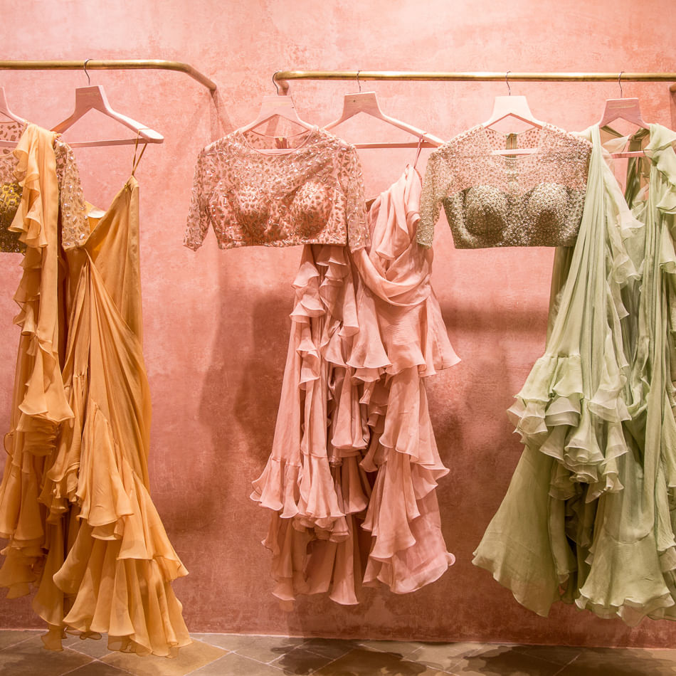 Clothing,Dress,Pink,Boutique,Clothes hanger,Peach,Textile,Fashion,Costume design,Room