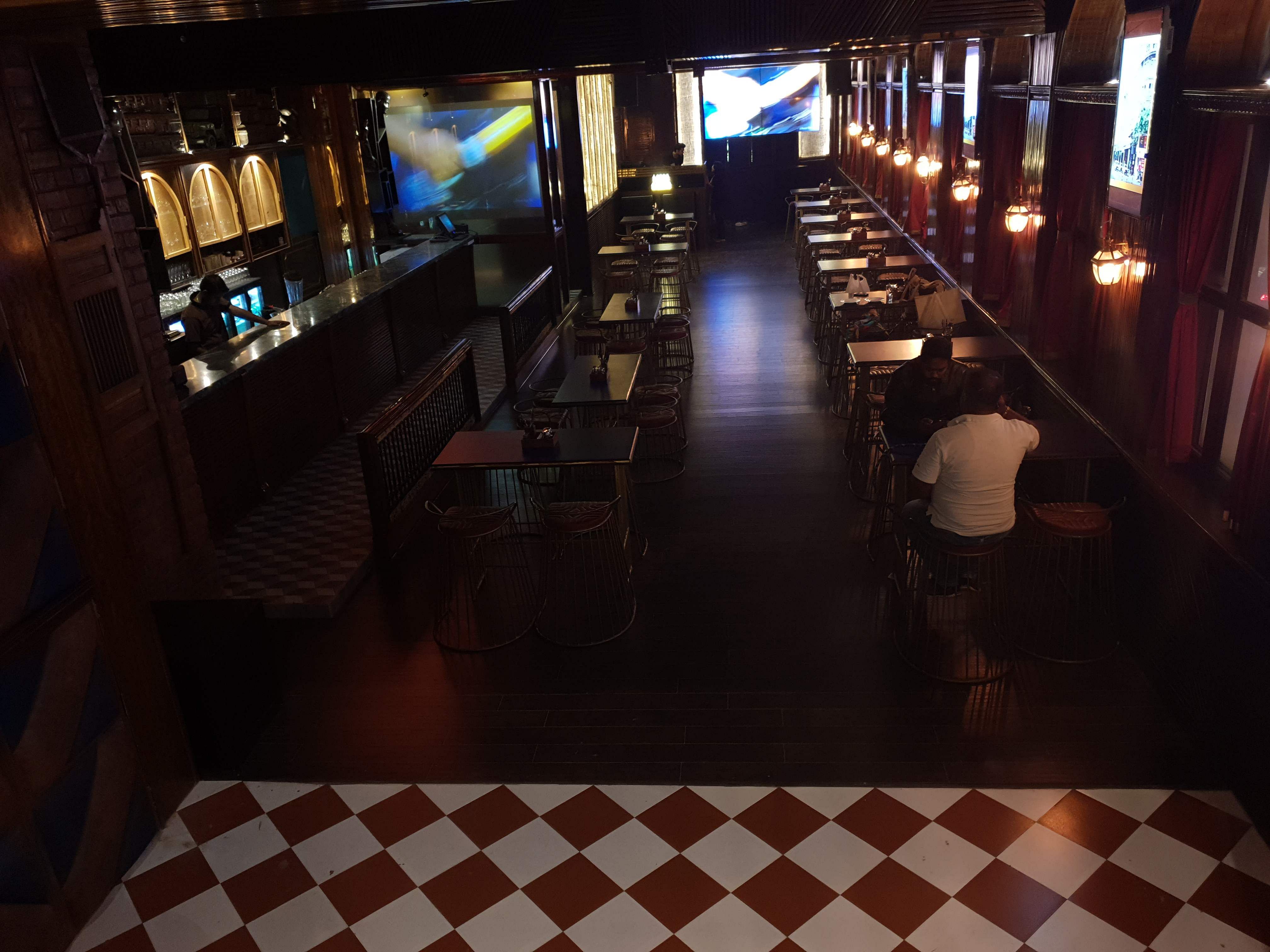 Floor,Flooring,Restaurant,Building,Bar,Architecture,Room,Night,Interior design,Pub