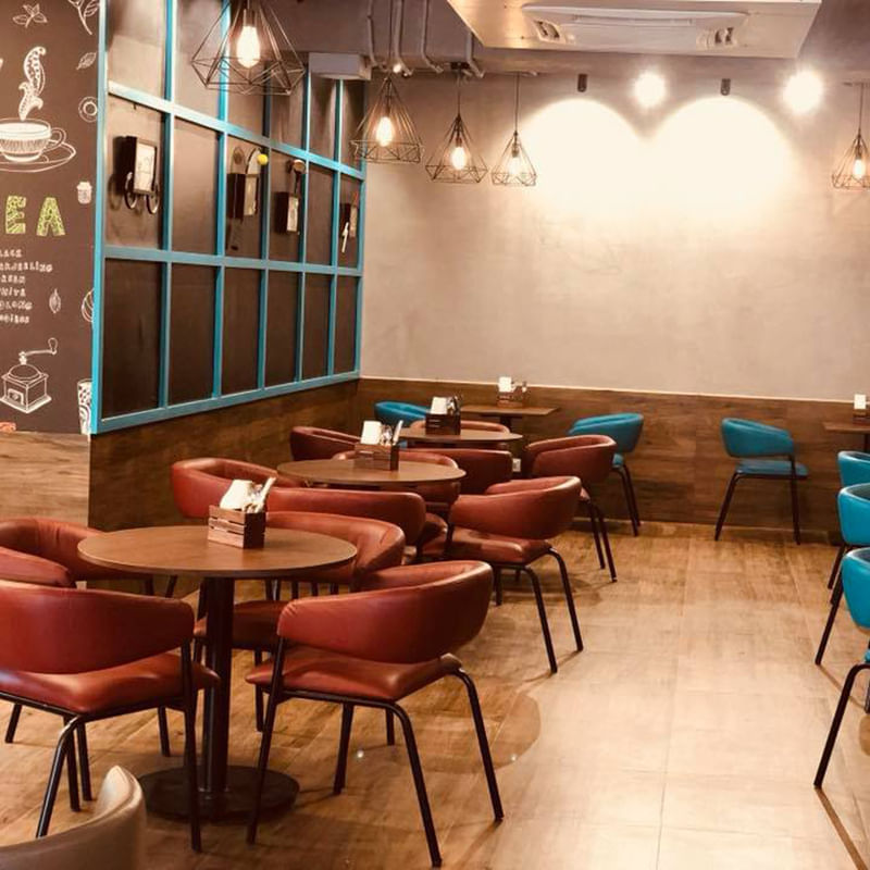 Restaurant,Room,Building,Interior design,Table,Furniture,Cafeteria,Coffeehouse,Café,Chair