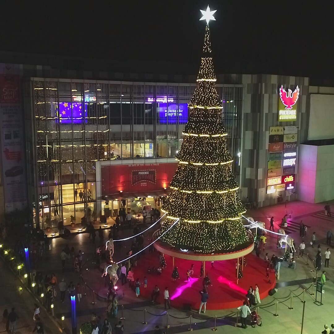 Christmas tree,Christmas decoration,Christmas,Tree,Christmas lights,Landmark,Christmas ornament,Lighting,Architecture,Christmas eve