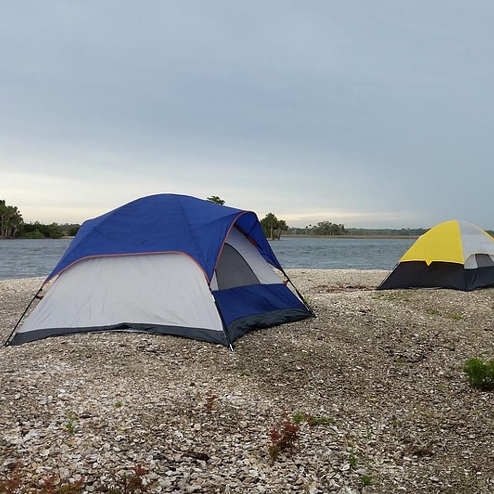 Tent,Camping,Blue,Sky,Natural environment,Wilderness,Grassland,Biome,Grass,Ecoregion