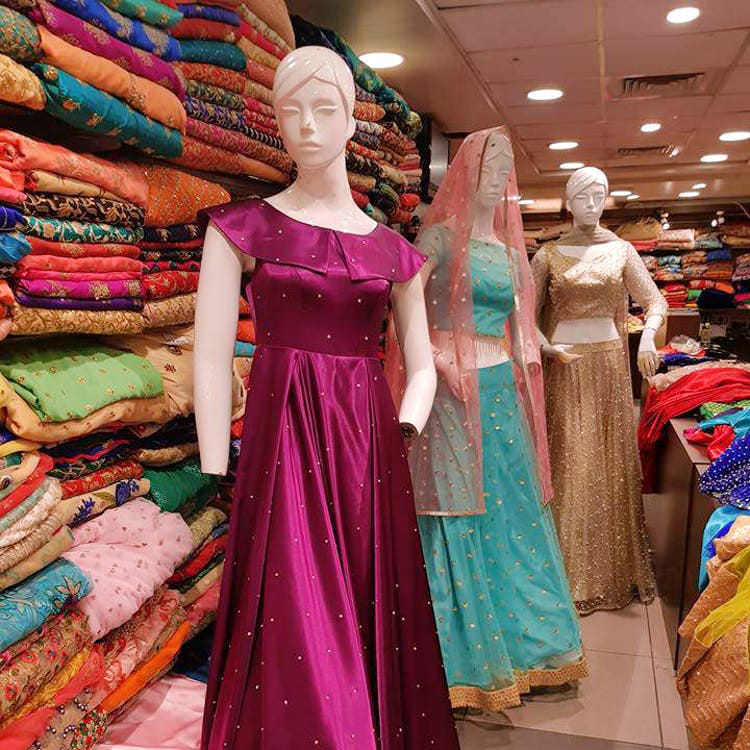 Clothing,Dress,Boutique,Pink,Formal wear,Fashion,Fashion design,Textile,Gown,Shoulder