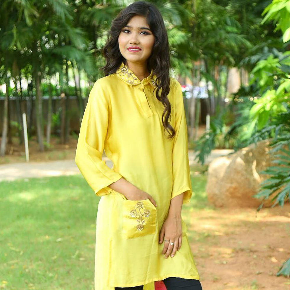 Clothing,Yellow,Formal wear,Sleeve,Outerwear,Neck,Fashion model,Blouse,Textile,Street fashion