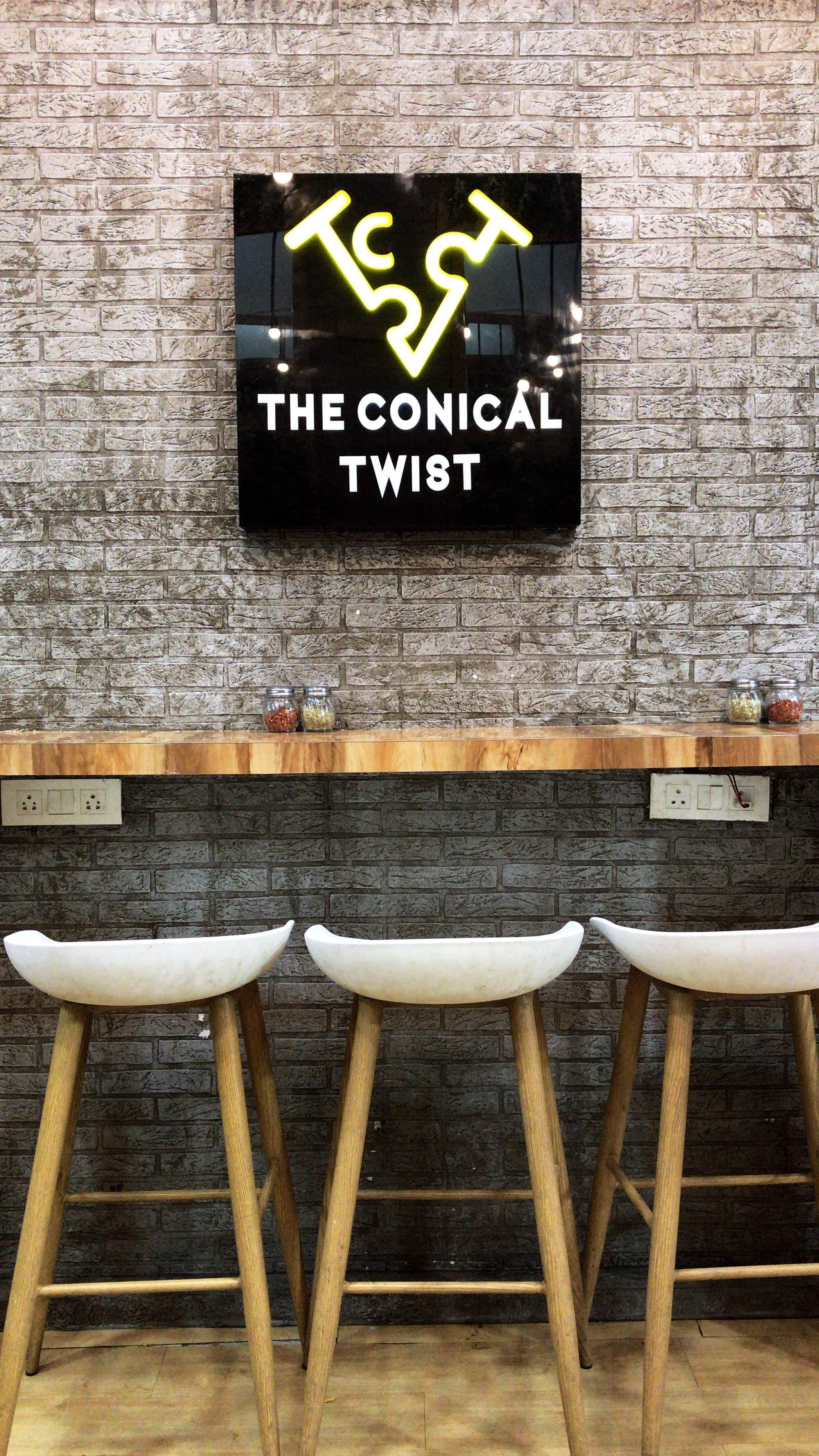 Furniture,Font,Table,Wall,Bar stool,Room,Chair,Design,Interior design,Stool