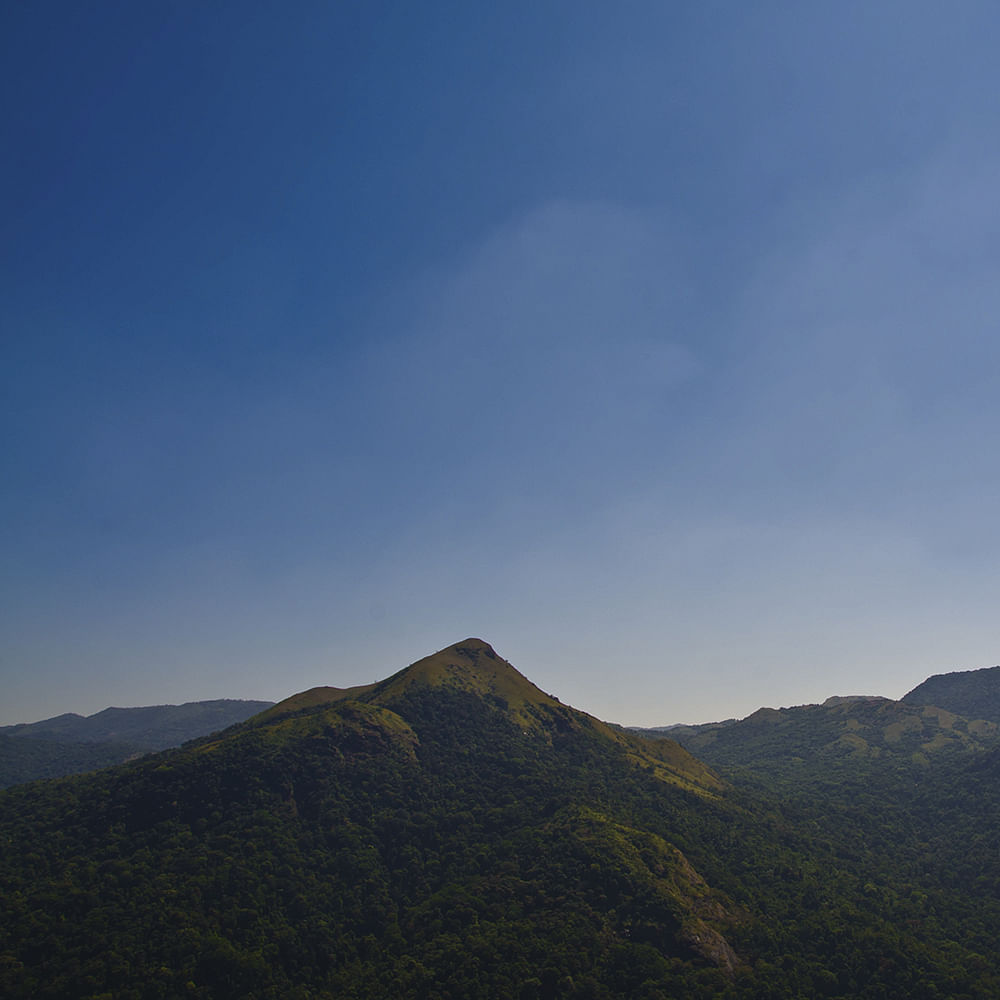 Mountainous landforms,Mountain,Highland,Sky,Ridge,Hill,Hill station,Mountain range,Atmospheric phenomenon,Fell