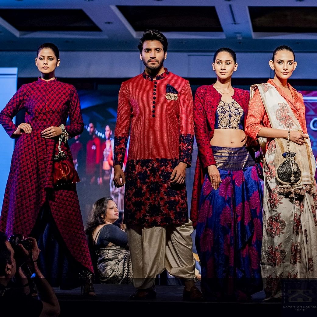 Event,Fashion,Fashion design,Performance,Stage,Formal wear,Sari,Textile,Magenta,Ceremony