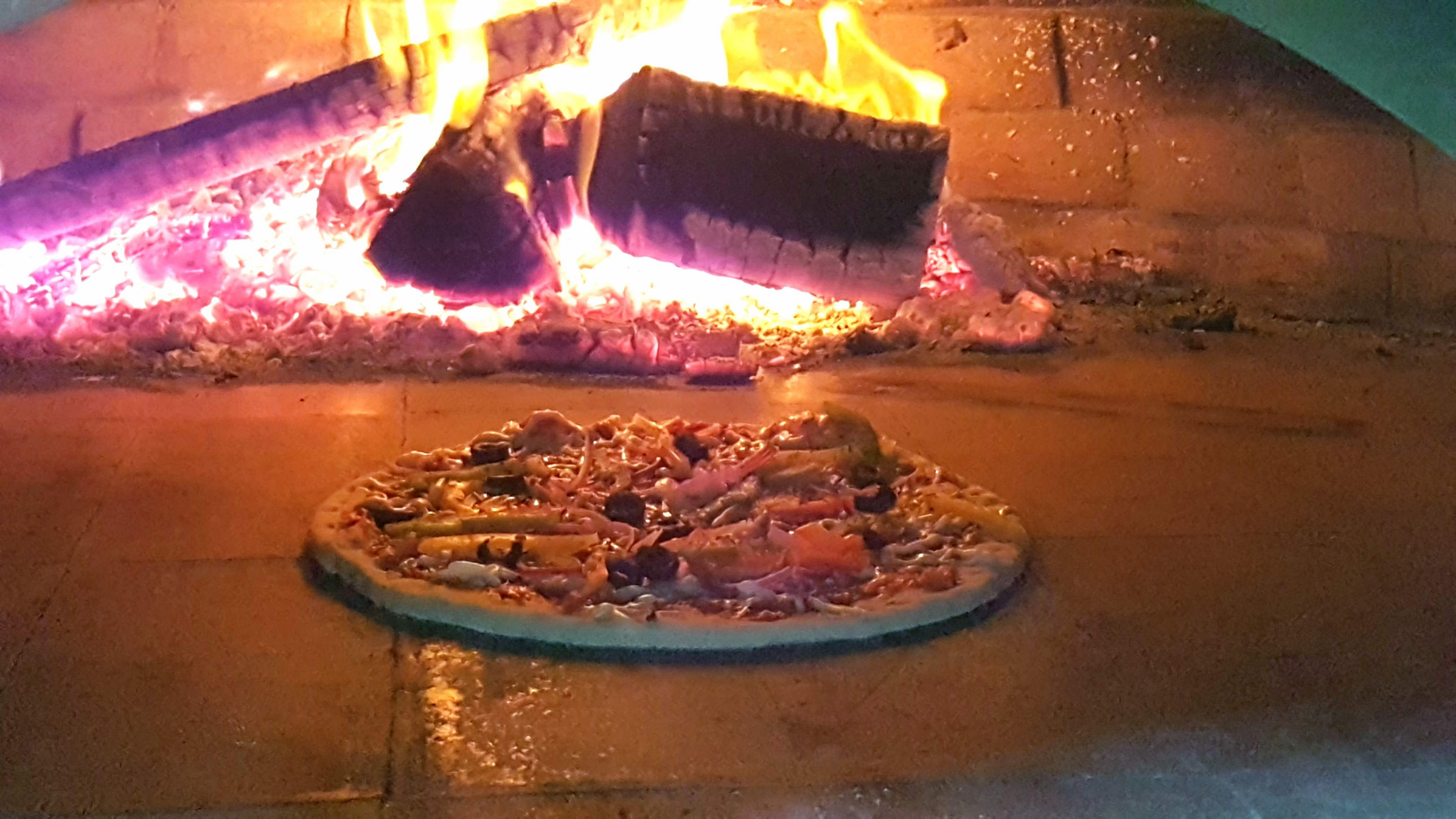 Dish,Cuisine,Masonry oven,Food,Flame,Oven,Fire,Steak,Pizza,Italian food